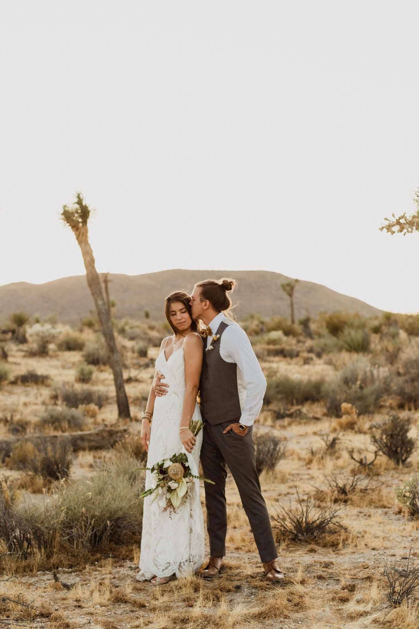 Michael and Alissa share a tender moment after deciding to elope in Joshua Tree National Park.
