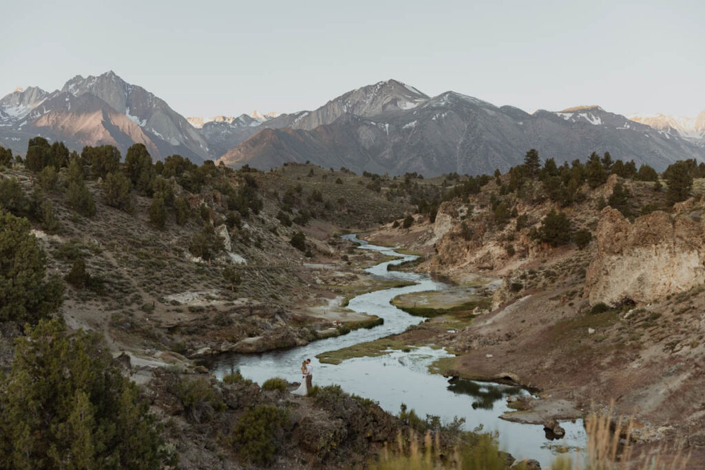 A couple says their vows at Hot Creek on their Mammoth Wedding day