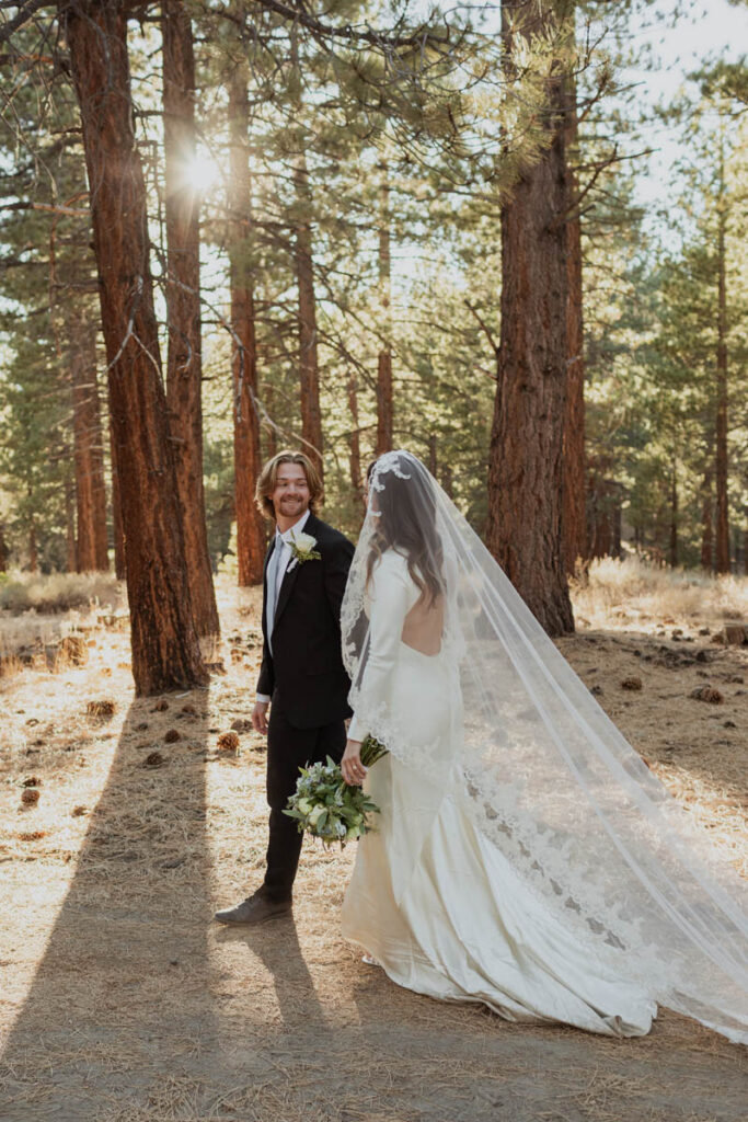A couple who just got married walk through Shady Rest Park on their wedding day
