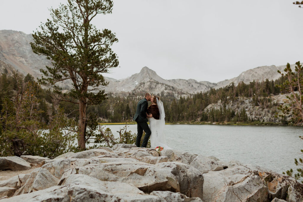 A couple exchanges vows at a high alpine lake in Mammoth Lakes, CA on their elopement day.